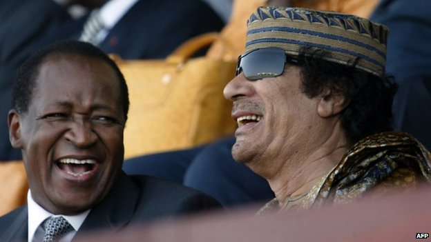 File photo: Burkinabe President Blaise Compaore (left) and Libyan head of state Muammar Gaddafi in Dakar, 3 April 2007 Mr Compaore was close to former Libyan leader Colonel Gaddafi