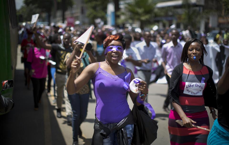 Kenyan women protest for the right to wear whichever clothes they want, at a demonstration in downtown Nairobi, Kenya Monday, Nov. 17, 2014. A recent incident in which a mob of men surrounded a woman and tore her clothes off, leaving her naked on the street in front of a bus stop after alleging that she was improperly dressed, is one of several such videos that have surfaced online in recent days leading to a groundswell of anger that on Monday prompted around 1000 demonstrators, including a number of men supporting the women's cause, to march through the capital and protest online using the hashtag #MyDressMyChoice. (AP Photo/Ben Curtis)