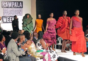 Models present creations made of bark cloth material by fashion designer Jose Hendo during the first fashion week show held in Kampala, on November 15, 2014 (AFP Photo/Amy Fallon)