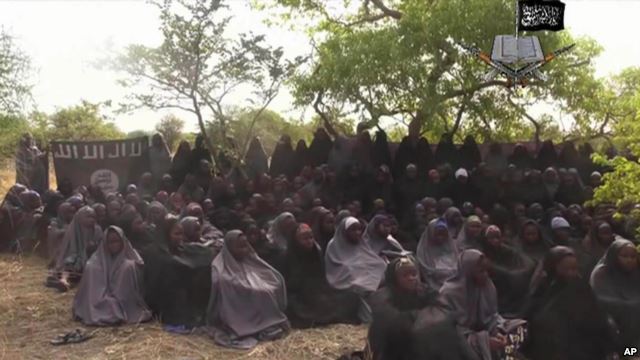 FILE- In this Monday, May.12, 2014 file image taken from video by Nigeria's Boko Haram terrorist network, shows the alleged missing girls abducted from the northeastern town of Chibok