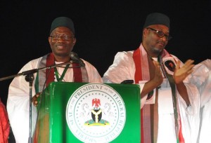 Nigeria's president Goodluck Jonathan (L) delivers a speech next to PDP National Chairman Adamu Muazu, after winning a presidential primary in Abuja, on December 11, 2014 (AFP Photo/Olamikan Gbemiga)