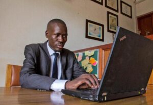 Gerald Abila's tech-savvy legal aid project, Barefoot Law, has helped hundreds of thousands with advice (AFP Photo/Isaac Kasamani) 