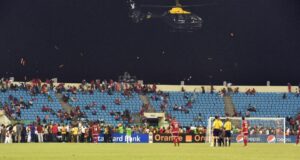 A police helicopter was required to disperse fans during the crowd violence that marred Equatorial Guinea’s match against Ghana. Photograph: Li Jing/Xinhua Press/Corbis 