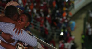 DRC fans celebrate in the upper tier of the stand after witnessing their team's fourth goal. Photo©Taimour Lay