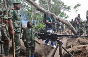 Lieutenant General Didier Etumba Longila (left), chief of the general staff of DR Congo armed forces, meets soldiers in Beni in North Kivu, in May last year (AFP Photo/) 