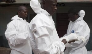  A burial team wearing protective clothing, prepare to enter the home a person suspected of having died of the Ebola virus, in Freetown September 28, 2014. Christopher Black/WHO/Handout via Reuters 