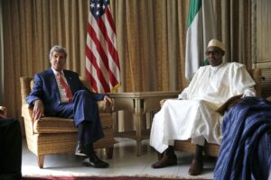 Photo by: Akintunde Akinleye U.S Secretary of State John Kerry sits beside Muhammadu Buhari, Nigeria's former military ruler and opposition party All Progressives Congress (APC) presidential candidate at the U.S. consulate house in Lagos, Nigeria, Sunday, Jan. 25, 2015. In a rare high-level visit to Africa's most populous country, Mr. Kerry on Sunday urged Nigeria's leading presidential candidates to refrain from fomenting violence after next month's vote, and he condemned savage attacks by Boko Haram, an al Qaeda-linked insurgency. (AP Photo/Akintunde Akinleye, Pool)