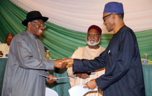 Nigerian President Goodluck Jonathan (left) and APC main opposition party presidential candidate Mohammadu Buhari shake hands on March 26, 2015 in Abuja Security is a major concern at Saturday's vote both from Boko Haram violence against voters and polling stations to clashes between rival supporters. In 2011, around 1,000 people were killed in violence after Jonathan beat Buhari to the presidency. AFP PHOTO / PHILIP OJISUA (AFP Photo/Philip Ojisua) 