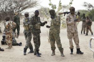 Chadian troops previously stationed by the Sudanese border make a stop on their way to lake Chad near Baga Sola Friday March 6, 2015. Large contingents of Chadian troops were seen heading to the region bordering Nigeria, where residents and an intelligence officer said Boko Haram fighters are massing at their headquarters in the northeast Nigerian town of Gwoza in preparation for a showdown with multinational forces. (AP Photo / Jerome Delay)