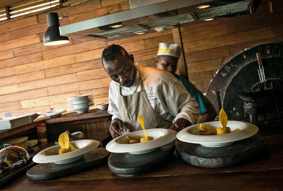 Chef Christian Yumbi has struggled against racism and the economic crisis in Belgium, but is finding the fame and fortune he hoped for back in DR Congo (AFP Photo/Federico Scoppa)