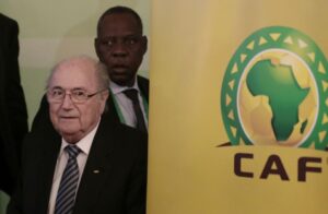 FIFA President Sepp Blatter, left, and Confederation of African Football President Issa Hayatou, back, leave a press conference in Cairo, Egypt, Tuesday, April 7, 2015. Every one of Africa's 54 member countries will vote for Sepp Blatter in next month's FIFA presidential election, the continent's soccer boss said on Tuesday, referring to the 79-year-old Swiss as "dear Sepp ". (AP Photo/Hassan Ammar)