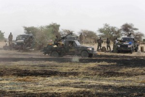 Chadian soldiers drive in the recently retaken town of Damasak, Nigeria, March 18, 2015. Armies from Nigeria, Cameroon, Chad and Niger have launched an offensive to end Boko Haram's six-year campaign, which has killed thousands in northern Nigeria and spilled over into Cameroon and Niger. REUTERS/Emmanuel Braun (NIGERIA - Tags: CIVIL UNREST MILITARY POLITICS) 