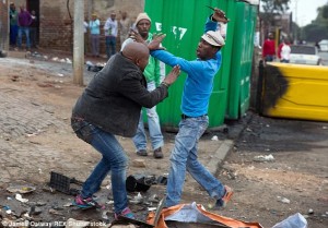 Horrific: The brutal murder of Mozambican man Emmanuel Sithole in a township near Johannesburg was captured on camera. Zwelithini has been blamed for sparking outbursts of xenophobic violence like this