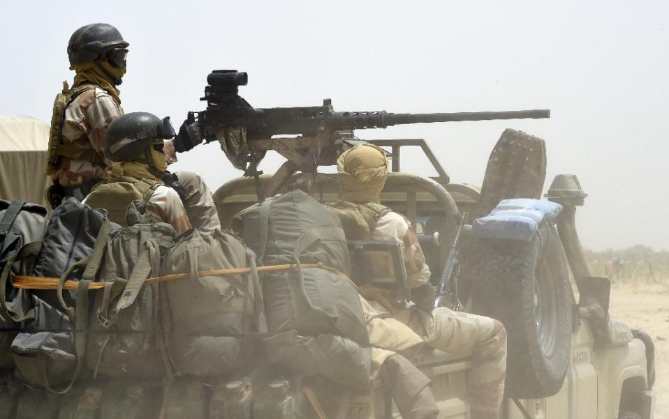 Nigerien army forces patrol in pickup trucks near Malam Fatori on April 3, 2015, after the town in north-eastern Nigeria was retaken from Boko Haram by troops from Chad and Niger (AFP Photo/Philippe Desmazes)