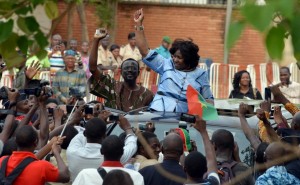 Mariam Sankara, widow former president Thomas Sankara, waves to the crowd upon her arrival at Ouagadougou's airport, Burkina Faso, on May 14, 2015 (AFP Photo/Ahmed Ouoba)