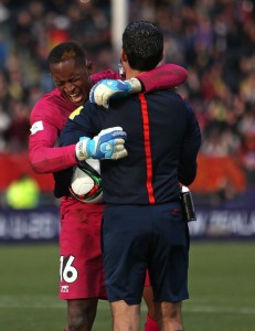 Goalie Djigui Diarra of Mali, left, embraces referee Cesar Arturo Ramos Palazuelos of Mexico as he celebrates their win over Germany in a penalty shoot out during their U20 soccer World Cup quarterfinal game in Christchurch, New Zealand, Sunday, June 14, 2015. Mali win on penalties 4 - 3. (AP Photo/Dianne Manson)