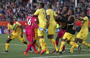 Mali teammates celebrate their win over Germany in a penalty shoot out during their U20 soccer World Cup quarterfinal game in Christchurch, New Zealand, Sunday, June 14, 2015. Mali win on penalties 4 - 3. (AP Photo/Dianne Manson)