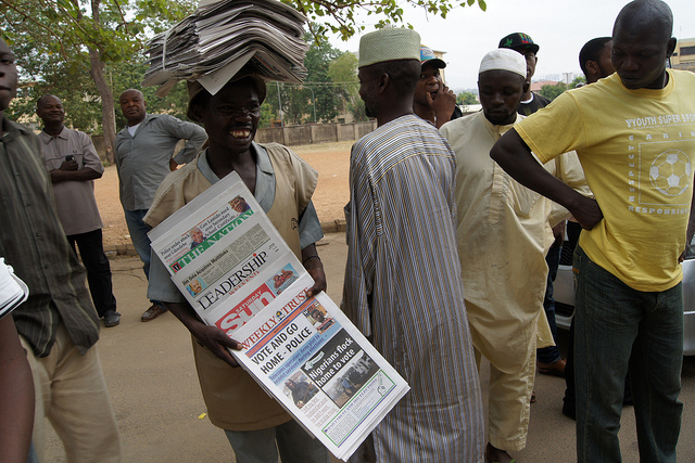 A newspaper vendor in Nigeria. Photograph by The Commonwealth.