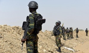 Cameroonian soldiers patrol in the town of Fotokol, on the border with Nigeria, on February 17, 2015, after clashes with Nigeria-based Boko Haram insurgents (AFP Photo/Reinnier Kaze)