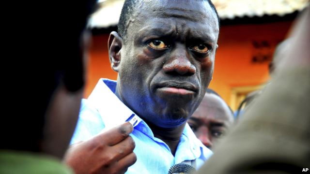 FILE - Ugandan opposition leader Kizza Besigye speaks to journalists.