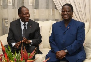 Ivorian President Alassane Ouattara (L) talsk to former President and the President of the Democratic Party of Cote d'Ivoire, Konan Bedie Henri, during a meeting in Abidjan, on October 27, 2015 (AFP Photo/Sia Kambou)