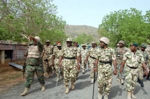 Nigerian Chief of Army Staff, Lieutenant General Kenneth Minimah (C) visits troops near Pulka, on the frontline in Borno State, northeast Nigeria on June 9, 2015 in a picture released on June 11, 2015 (AFP Photo/)