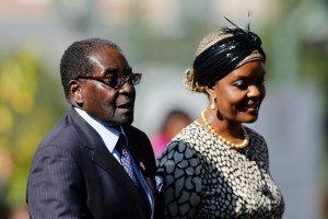 Zimbabwean President Robert Mugabe and his wife Grace arrive for a 2014 ceremony in Pretoria, South Africa (AFP Photo/Siphiwe Sibeko)