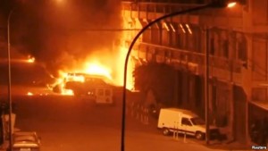 A view shows vehicles on fire outside Splendid Hotel in Ouagadougou, Burkina Faso in this still image taken from a video, Jan. 15, 2016, during a siege by Islamist gunmen.