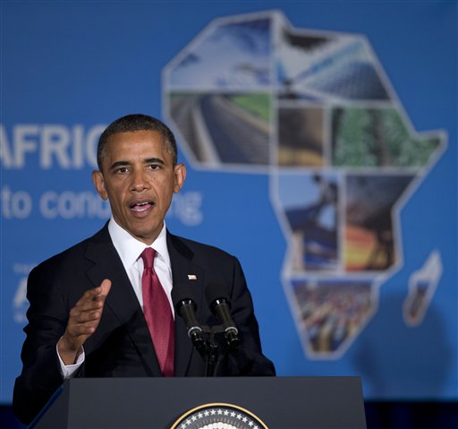 President Barack Obama gestures while speaking at a business forum aimed at increasing investment in Africa, Monday, July 1, 2013, in Dar Es Salaam, Tanzania. The president is traveling in Tanzania on the final leg of his three-country tour in Africa. (AP Photo/Evan Vucci