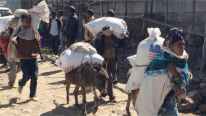 Families begin their journey home from the Estayesh food distribution site in Denkena Kebele, Meket Woreda, Ethiopia [AP]