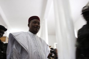 Niger President Mahamadou Issoufou prepares to cast his ballot during elections in Niamey, Niger, Sunday, Feb 21, 2016. Voting has begun in the West African nation of Niger, where Issoufou is touting his record of defending the country from Islamic extremists as he vies against 14 other candidates for a second five-year term.