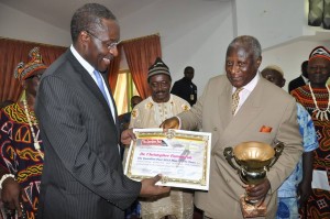 Dr. Fomunyoh is presented with the award by Batonnier Emeritus of the Cameroon Bar Association and former chairman of the AFP opposition party , Barrister Ben Muna