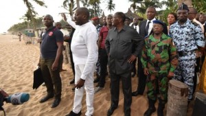 President Ouattara (centre) visited the beach resort after the attack