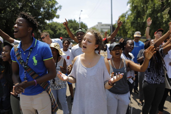 Some of the hundreds of young people gather during a mass, multi racial pray group, to pray for peace and calm after clashes at the University of Pretoria, Pretoria, South Africa, 25 February 2016. The campus was shut down after supporters of the EFF (Economic Freedom Fighters) clashed with members of the Afrikaans student community on 22 February over the EFF wanting to drop Afrikaans as the main language at the University of Pretoria. Universities through out the country are experiencing violent clashes during a five-month long student uprising. Kim Ludbrook/ Newscom