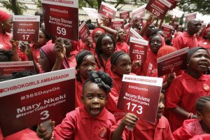 Young girls known as Chibok Ambassadors, carry placards bearing the names of the girls kidnapped from the government secondary school in Chibok in April 2014 in Abuja, Nigeria. Nigerian President Muhammadu Buhari is inviting the United Nations to help negotiations to swap the kidnapped schoolgirls from Chibok for detained leaders of the Boko Haram Islamic extremist group.