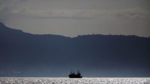 FILE - Chinese fishing trawlers anchor off the coast of Freetown, Nov. 18, 2012