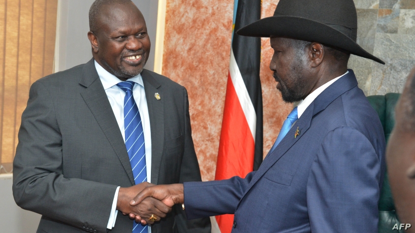  South Sudan's President Salva Kiir (R) shakes hands with opposition leader Riek Machar before their meeting in Juba, South Sudan, Sept. 11, 2019.