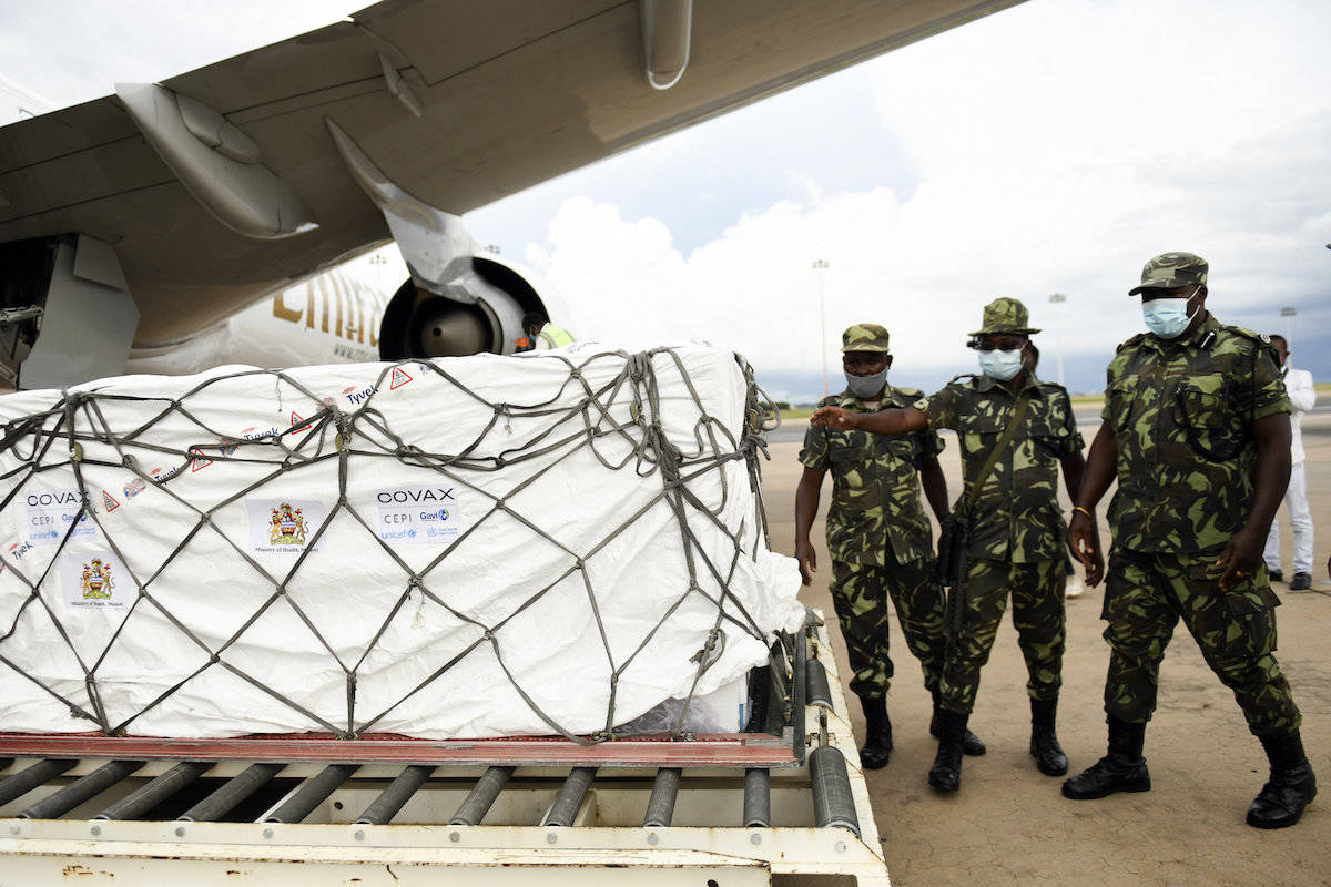 Malawian police guard AstraZeneca COVID-19 vaccines after the shipment arrived in Lilongwe, Malawi, Friday March 5, 2021. Canada is expecting its first shipments of AstraZeneca vaccine next week. (Associated Press/Thoko Chikondi)